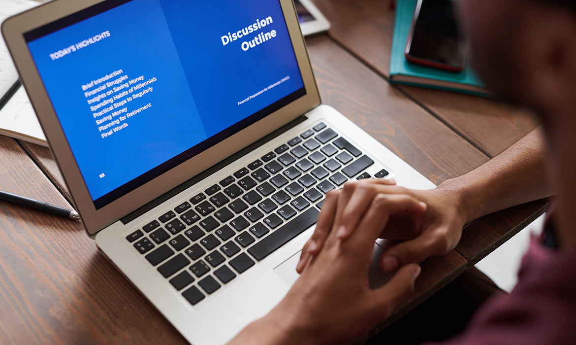 a person looking at their laptop