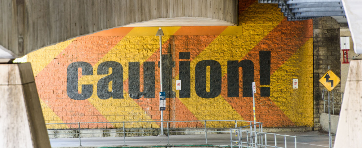 caution painted on a wall