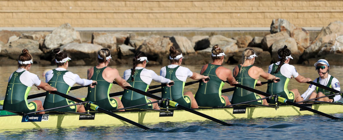women rowing a long boat