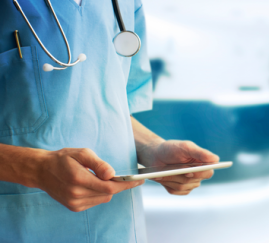 healthcare professional holding an ipad
