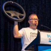 Kelvin Ross holding a steering wheel for Fatigue M8