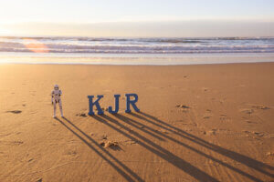 KJR logo in the sand on a beach
