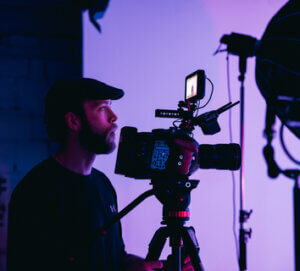 a man with a filming camera