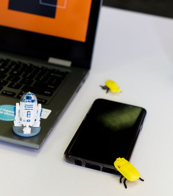 A phone left next to a laptop