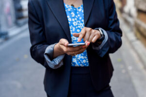 Picture of females hands texting with phone