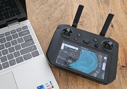 A controller next the laptop